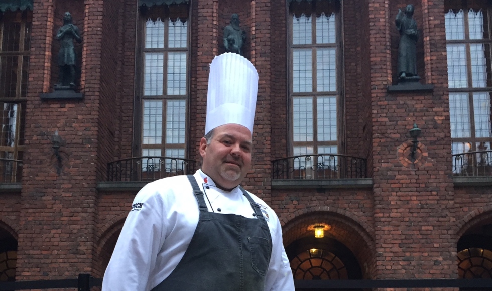 Picture of an Executive Chef Paul Hoag From Upward Angle in Front of Building